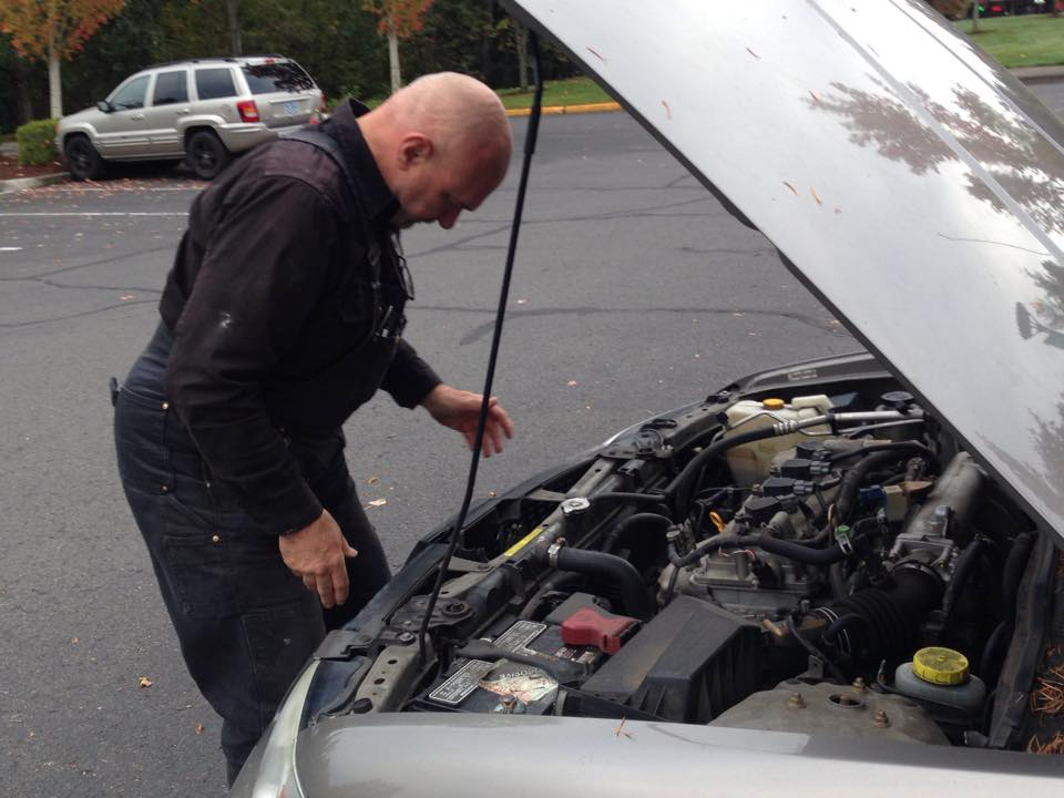 Mechanic inspecting engine