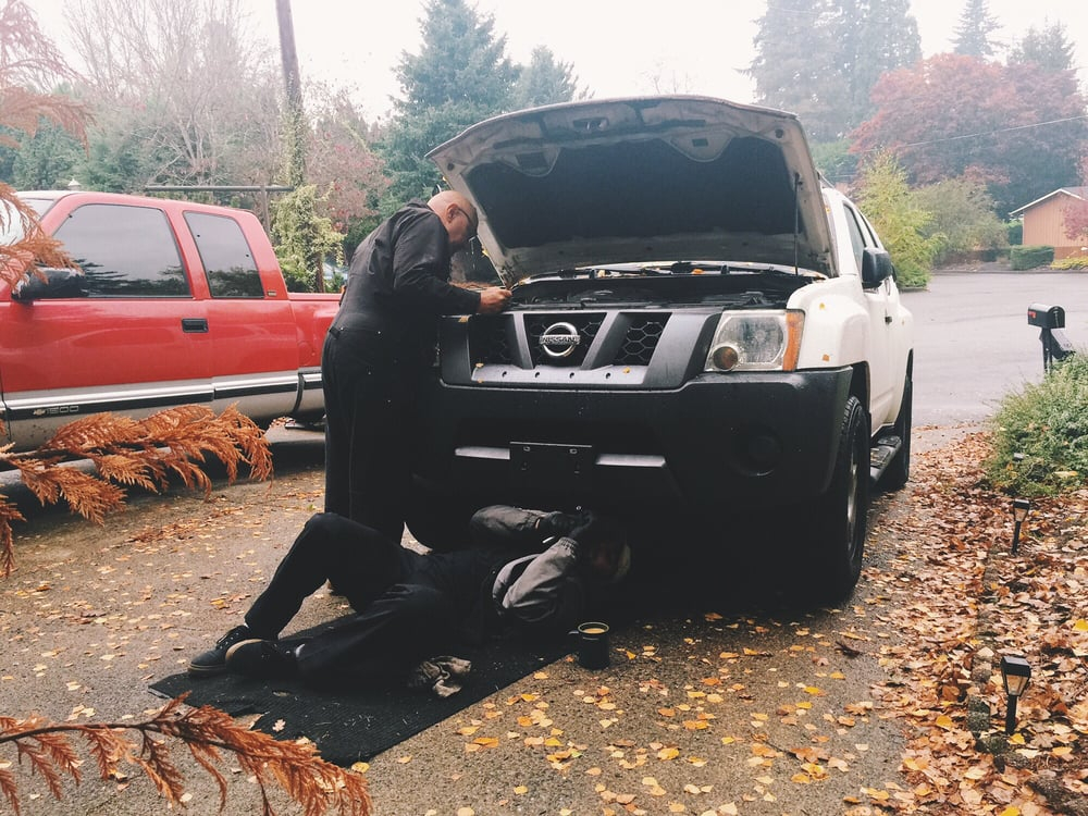 Mechanic working on pickup truck